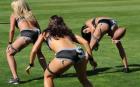Centre Jessica Renee (R) trains with her Lingerie Football League team, the Los Angeles Temptation, at the Los Angeles Memorial Coliseum.  The Temptations will play the San Diego Seduction at the stadium on January 29